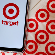 Bahia, Brazil - September 30, 2020.  Target Store logo on smartphone screen on top of Target shopping bag. Hypermarket. 