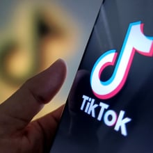 An illustration of the tiktok logo inside a phone