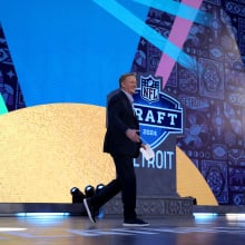 nfl commissioner roger goodell walking across the nfl draft stage