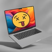 M2 MacBook Pro with a dead smiley face on it