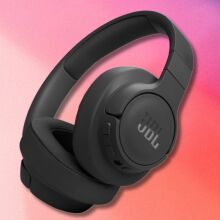 black jbl tune 770nc headphones on a light pink and purple gradient background