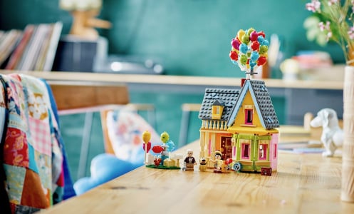 Lego model of the Pixar 'Up' house sitting on a table in a home