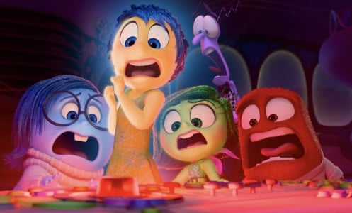 Sadness, Joy, Fear, Disgust, and Anger from "Inside Out 2" gather around a glowing red console, screaming in fear.