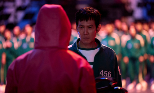 Lee Jung-jae as Seong Gi-hun in Squid Game Season 2, facing off with a game overseer.