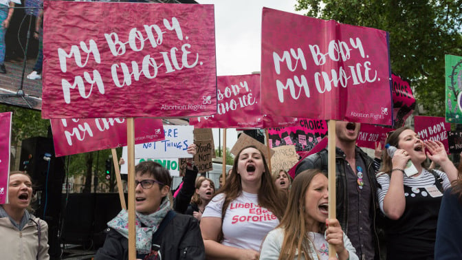 Pro-choice supporters stage a demonstration in Parliament Square to campaign for women's reproductive rights, legalisation of abortion in Northern Ireland and its decriminalisation in the UK on 11 May, 2019 in London, England.