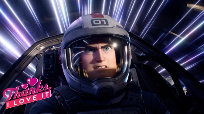 A man in a space suit sits in a cockpit while space flashes by around him.