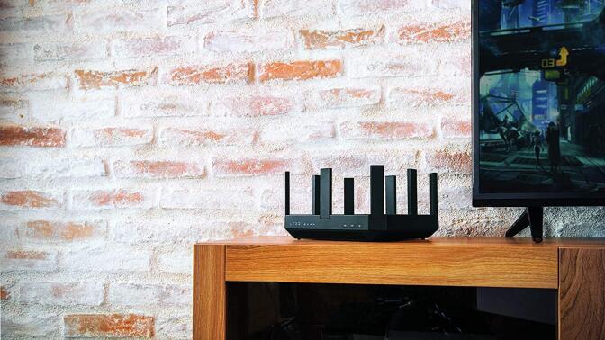 router on wooden stand against brick wall