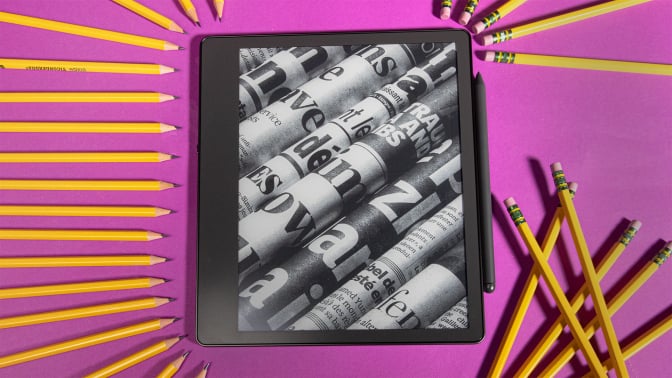 Kindle Scribe surrounded by writing utensils