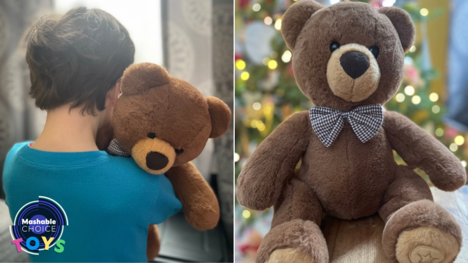 little boy hugging a teddy bear / teddy bear in front of a christmas tree