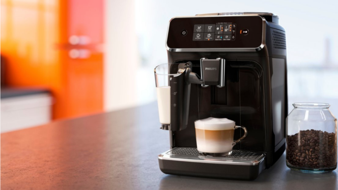 phillips espresso maker on a kitchen counter against an orange and red background