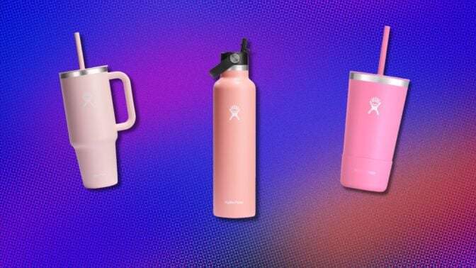 thee pink hydroflask bottles on a purple background