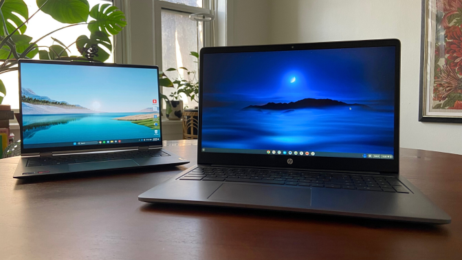 a lenovo thinkbook and an hp chromebook plus sitting on a wood table in front of houseplants