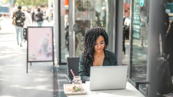 Girl using laptop at desk