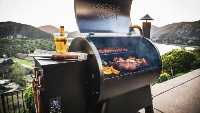 A Traeger grill loaded up with food