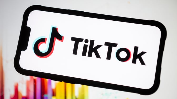 TikTok logo displayed on a phone screen. 