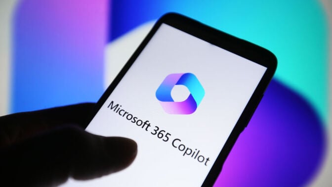 Microsoft 365 Copilot logo is seen on a smartphone screen.