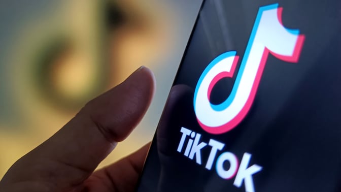 An illustration of the tiktok logo inside a phone