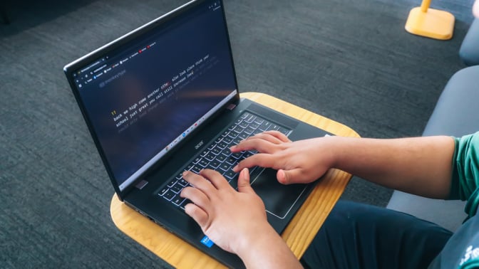 Mashable's Alex Perry using the Acer Chromebook Plus 516 GE