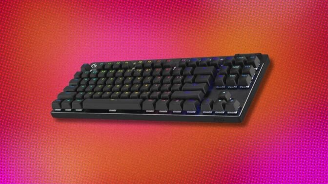 a logitech gaming keyboard on a pink and orange pixelated background