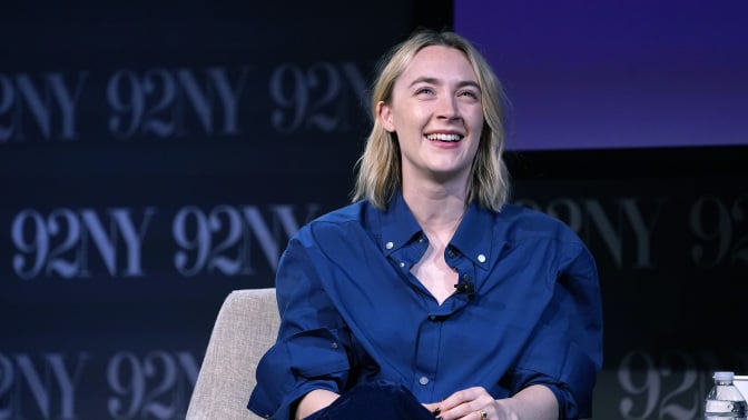 saoirse ronan onstage at a panel