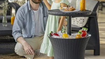 man and young girl standing next to table